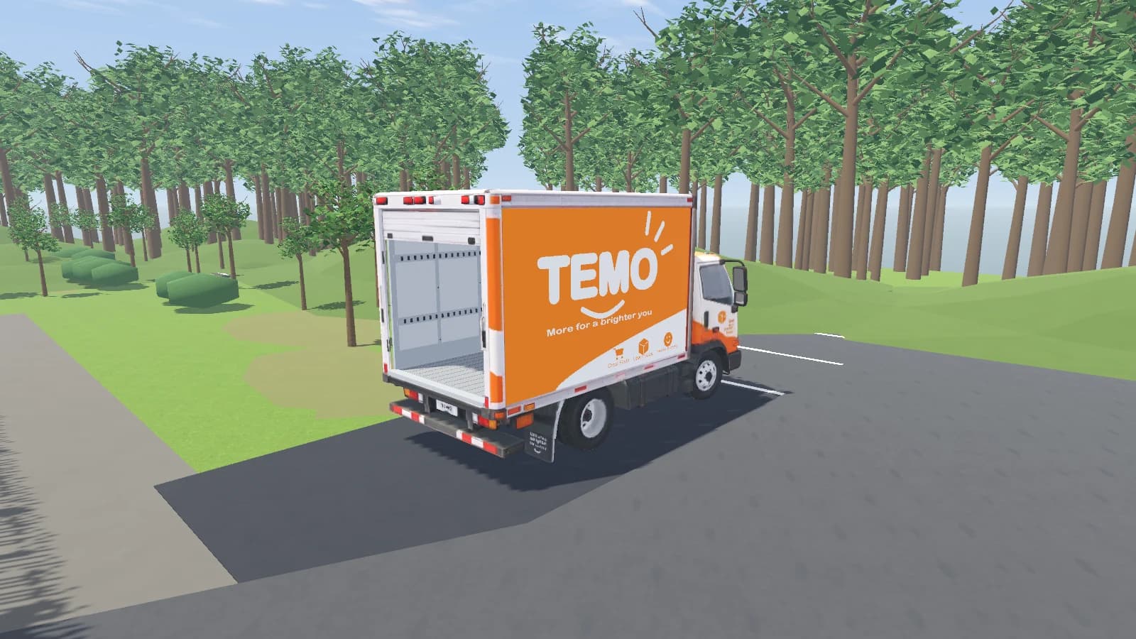 The TEMO delivery lorry outside the compound, with its rear shutter open and empty cargo bay.