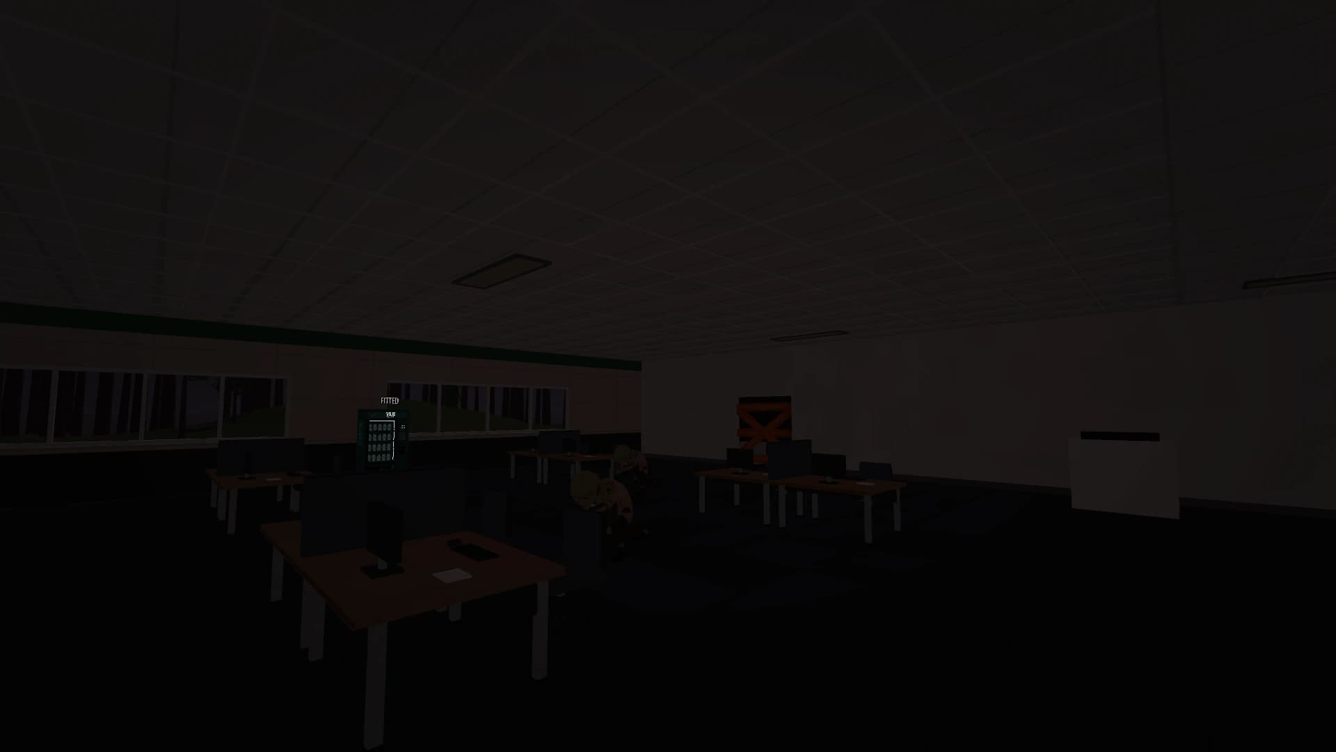 The same office during a power failure, with the new darkened edge effect around the player's view.