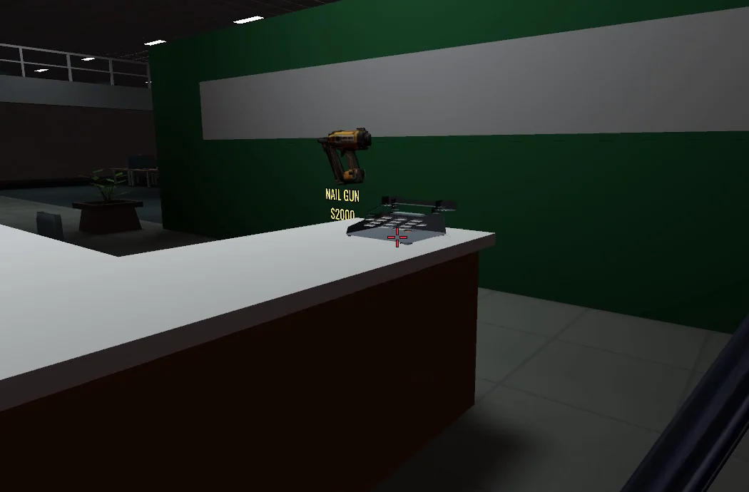 Dark office landline on the white front desk in the atrium, beside the Nail Gun wall shop.